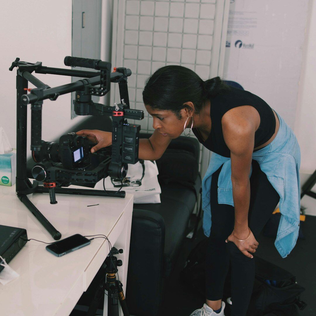 Lighting technician adjusting a studio softbox light rig